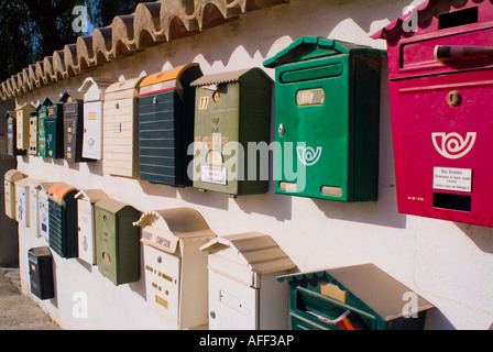 Group of mailboxes on wall in Spain Stock Photo
