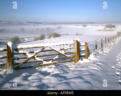 Winter snowscape and five barred gate in rural Lincolnshire Wolds Stock Photo