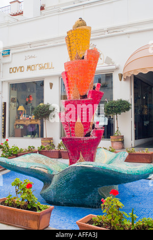Colorful ceramic tile water fountain in shopping plaza in Nerja Spain Stock Photo