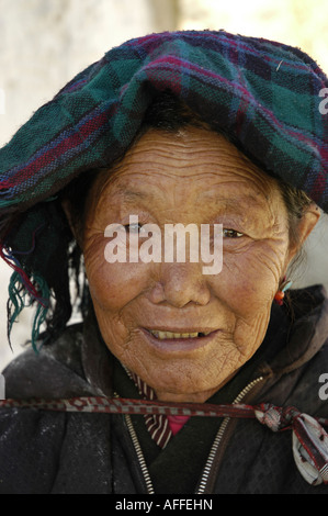 Vertical portrait of old Tibetan woman Gyantse Stock Photo