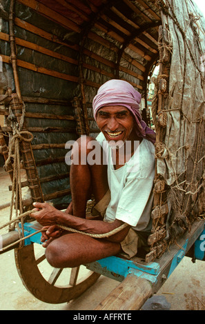 India Karnataka Mysore people smiling man in bullock cart Stock Photo