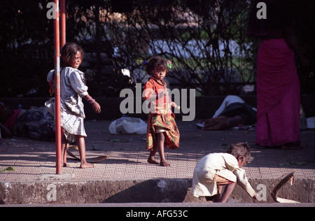 a a homless family begging on the streets of mumbai india Stock Photo