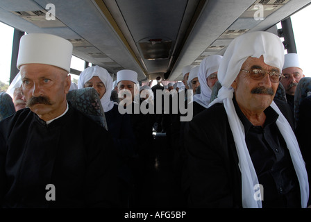 Members of the Druze community sit in a bus crossing the Israeli border into Syria, Golan Heights, Israel Stock Photo