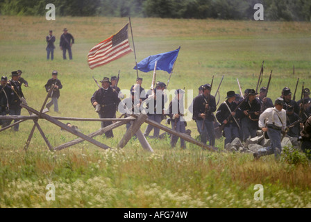 civil war reenactor Gettysburg PA battle field Yankee northern troops charge picket fence Stock Photo