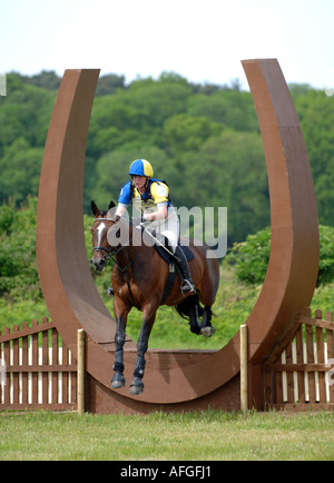 Horse rider jumps a fence during a one day eventing competition at Moreton in Dorset Britain UK Stock Photo
