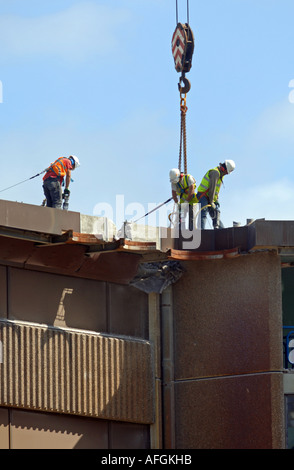 Construction workers use pneumatic drill to demolish a building, Britain UK Stock Photo