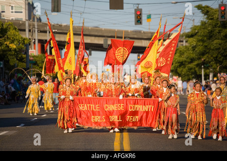 Seattle Chinese Community Girls Drill Team in the Chinatown International District Seafair parade Seattle Washington USA Stock Photo