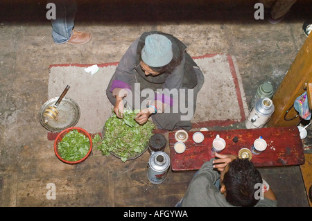 Old woman from Ladakh in the kitchen, Nurla village, Indus valley, Jammu and Kashmir, India Stock Photo