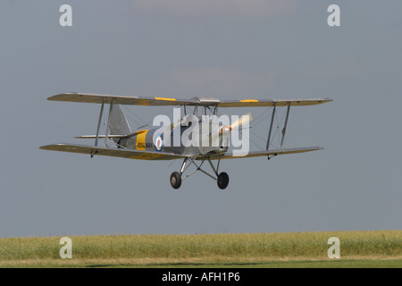 De Havilland DH 82 Tiger Moth vintage classic biplane coming into land Stock Photo