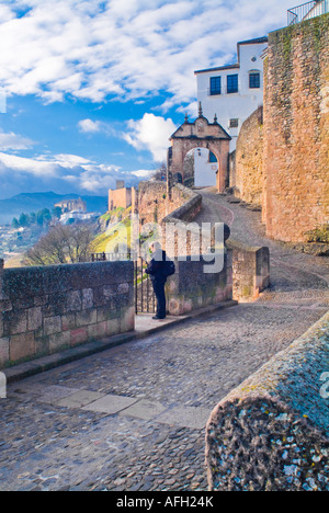 Arch of Philip V Roman bridge and walkway in Ronda Spain Stock Photo