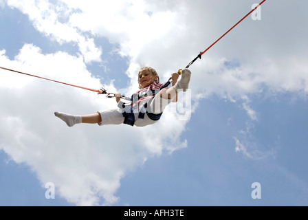 Girl jumping on a Bungee trampoline Stock Photo