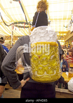 Europe Germany Munich Beer Festival Oktoberfest people dancing and drinking in tent hall and partying. Stock Photo