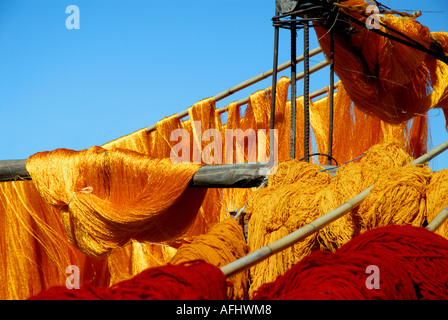Coloured silks hanging out to dry in the Souk des Teinturiers the dyers souk northern Medina Marrakesh Marrakech Morocco North Stock Photo