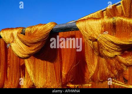Coloured silks hanging out to dry in the Souk des Teinturiers the dyer s souk northern Medina Marrakesh Marrakech Morocco North Stock Photo