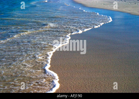 Waves lapping on secluded beach of Galapagos Islands Ecuador South America Stock Photo