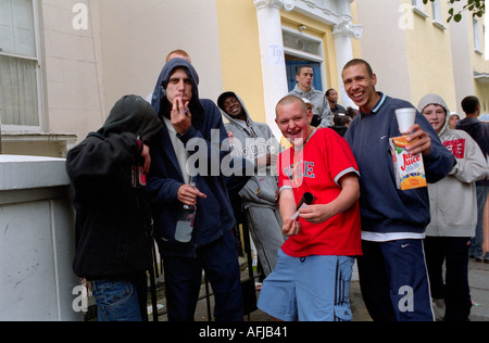 Group of male youths fooling around in streets of west London. Stock Photo