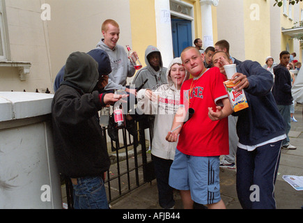 Group of  youths hanging around in streets of west London. Stock Photo