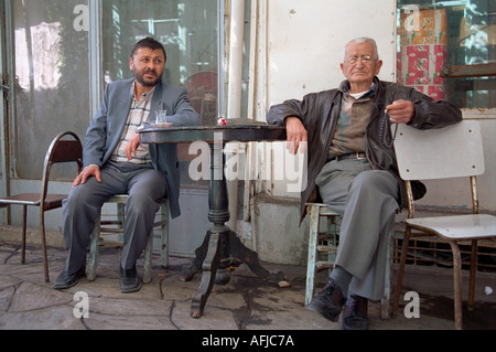 Older men sitting in small rural village in South Western Turkey. Stock Photo