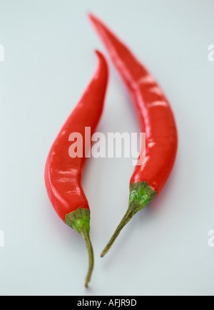 Chillies on pale blue background Stock Photo