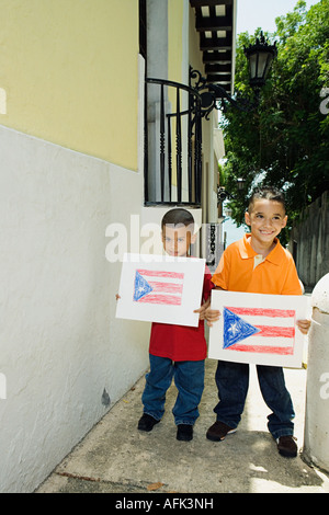 Boys holding drawing of the Puerto Rican flag. Stock Photo