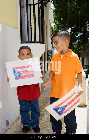 Boys holding drawing of the Puerto Rican flag. Stock Photo