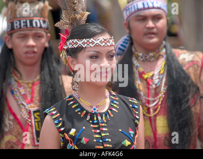 Malaysian performers dance in traditional clothing during cultural 