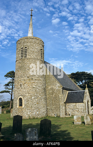 St Mary's Church, Titchwell, Norfolk, England, with round tower and small steeple on top, sky and clouds behind Stock Photo