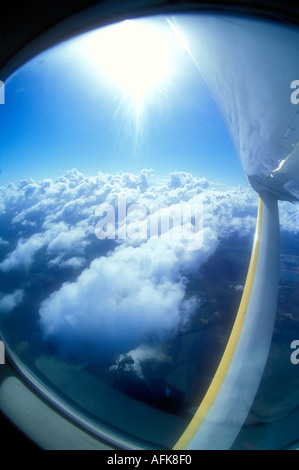 View of clouds and sky out of small airplane window Stock Photo