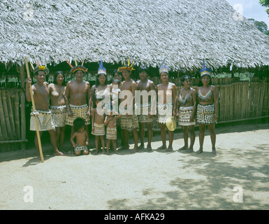 Family group of few remaining Bora indian tribe posing for the tourist trade in the peruvian rainforest near Iquitos 2004 Stock Photo