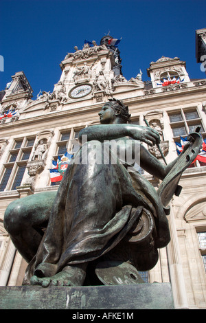 FRANCE Ile de France Paris One of several female bronze statues in front of Town Hall or Hotel de Ville with French flags