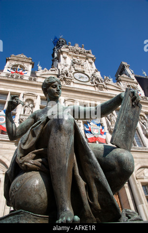 FRANCE Ile de France Paris One of several female bronze statues in front of Town Hall or Hotel de Ville with French flags