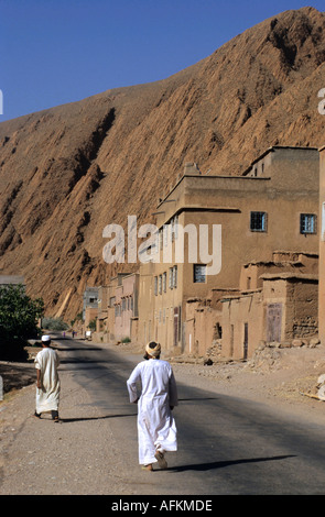 Morocco, Dades Gorges - Men Walking On The Road Stock Photo