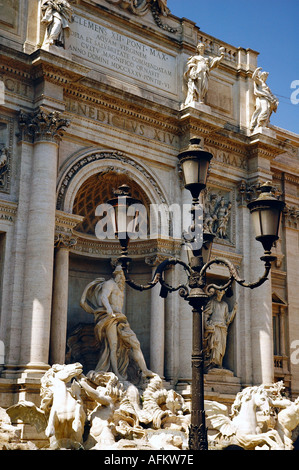 Famous Trevi Fountain in Rome Lazio Italy Europe. Clear sunny summer day - scenic. Statues at the Trevi Fountain. Stock Photo