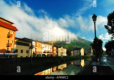 An unknown beautiful village in Italy. At sunrise, with wispy clouds and a blue sky. Stock Photo