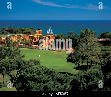 Pine Cliffs Golf Course with seaview Algarve South Portugal. Praia da Falesia Beach sailboat trip holiday destination. Aerial drone view putting green Stock Photo