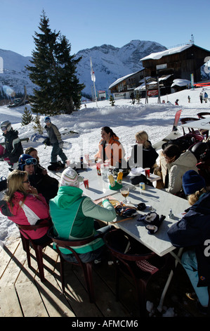 Snowboarders eat lunch at a mountain cafe, Avoriaz, Alps, France, Europe Stock Photo