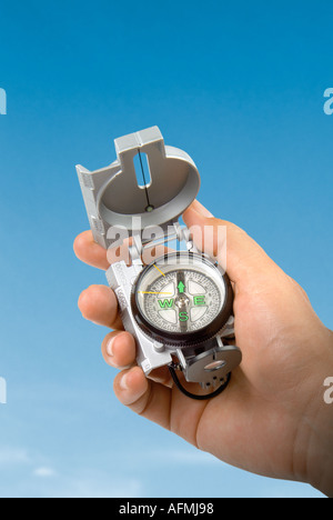 compass in a hand Hand mit Kompass Lunette Stock Photo