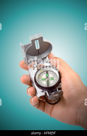 compass in a hand Hand mit Kompass Lunette Stock Photo
