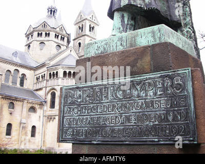 panel at Cuypers statue with distant view of Munsterkerk Munsterplein Roermond Limburg Netherlands Stock Photo