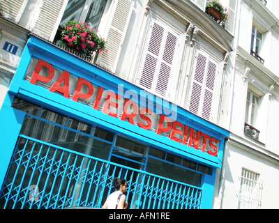 Facade of blue painted Papiers Peints shop Rue de la Vieuville Montmartre Paris France Stock Photo