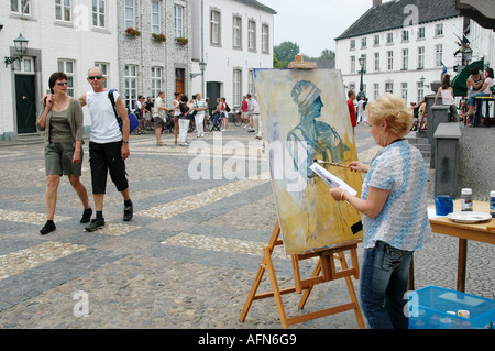 artist at work at Wijngaard square in centre of Thorn Limburg Netherlands Stock Photo