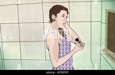 Woman holding a make-up brush Stock Photo