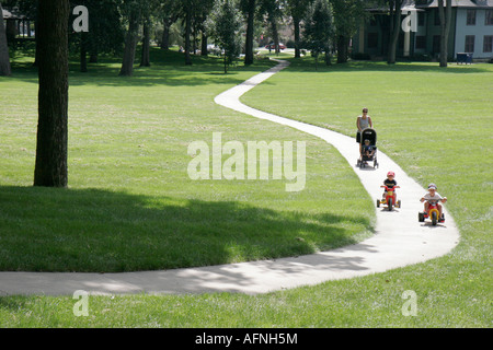 Indiana Kosciusko County,Winona Lake,Winona Lake Park,mother,parent,parents,stroller,boy boys,male kid kids child children youngster,big wheels,IN0708 Stock Photo