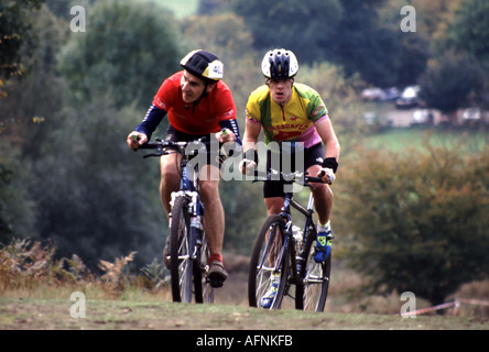 Brentwood Weald Country Park operated by Essex County Council close up two competitors taking part in 1992 cross country hilly bike race England UK Stock Photo
