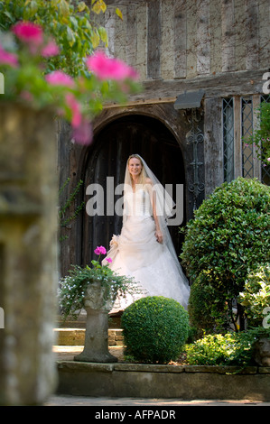 A bride in a doorway wearing a bespoke handmade wedding dress by Becky Drinan. Picture by Jim Holden. Stock Photo