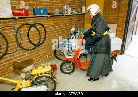 Nuns UK 1980s Sister Angela on her scooter Church of England Society of St Margaret, Haggerston, Hackney, East London  London 1989 1980s  HOMER SYKES Stock Photo