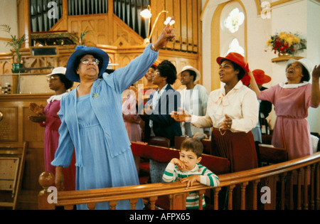 Praise The Lord is cried out Pentecostal church service in Brixton 1990s UK multiethnic Sunday worship south London 90s England HOMER SYKES Stock Photo