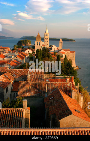 Sun sets on the famous bell towers Old Town Rab Croatia Stock Photo
