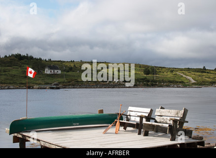 pier with Adirondack bench and upside down Old Town canoe, Nova Scotia, Canada. Photo by Willy Matheisl Stock Photo