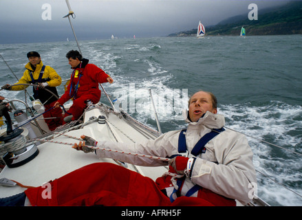 Sailing racing yacht UK Crew in The Round the Island Race race the Isle of Wight England 1980s HOMER SYKES Stock Photo